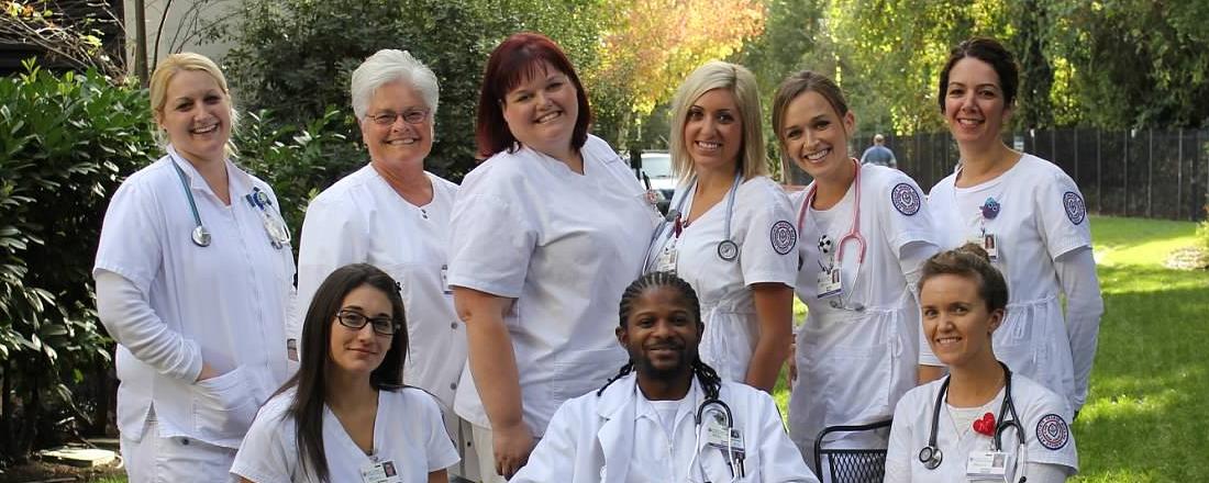 A group of nursing students posing for a candid photo